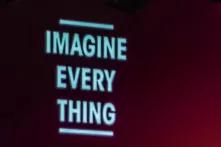 Auf einem rot bis schwarz verlaufenden Hintergrund stehen die englischen Worte: Image every thing